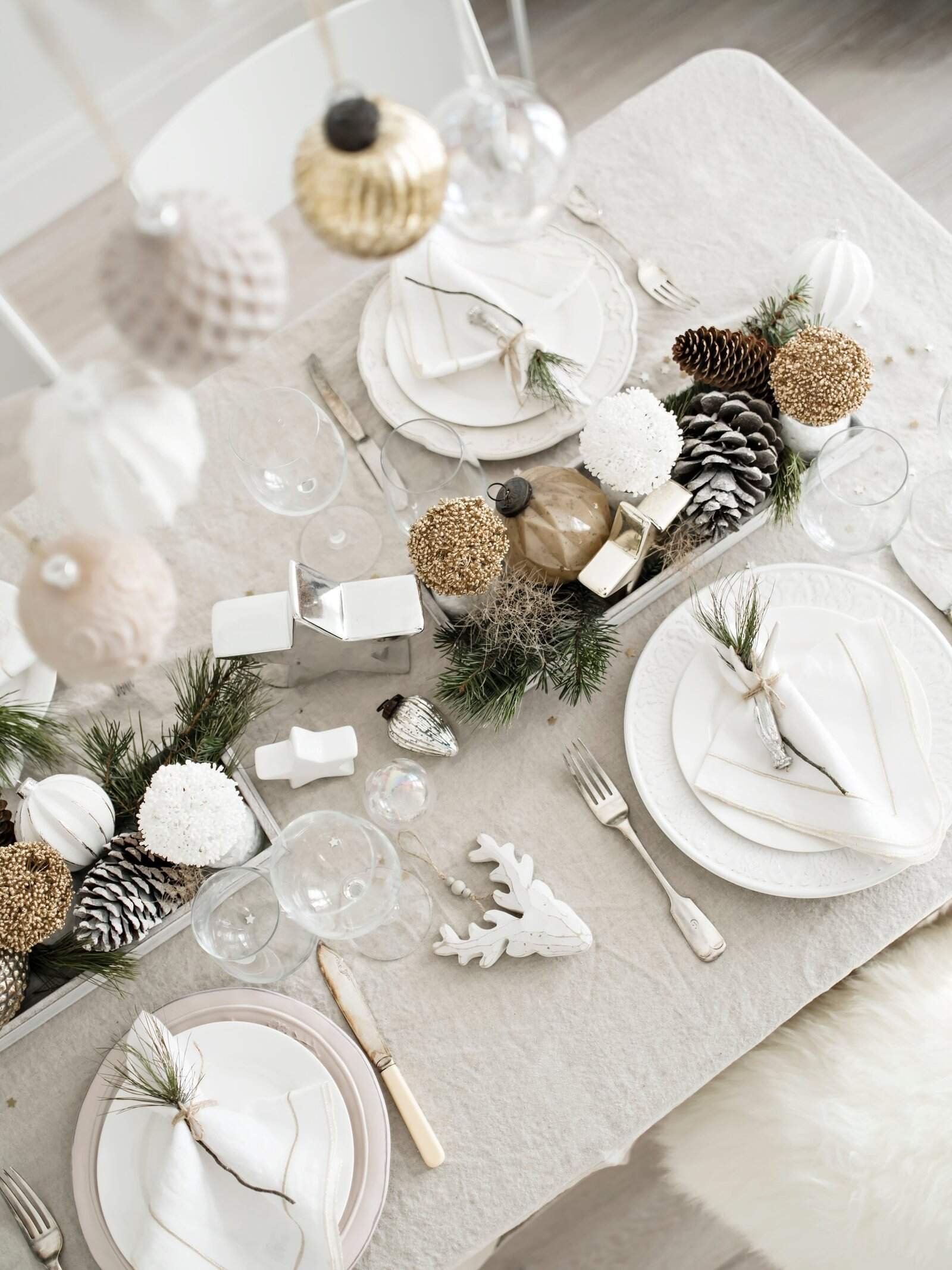 a table setting with a white table cloth