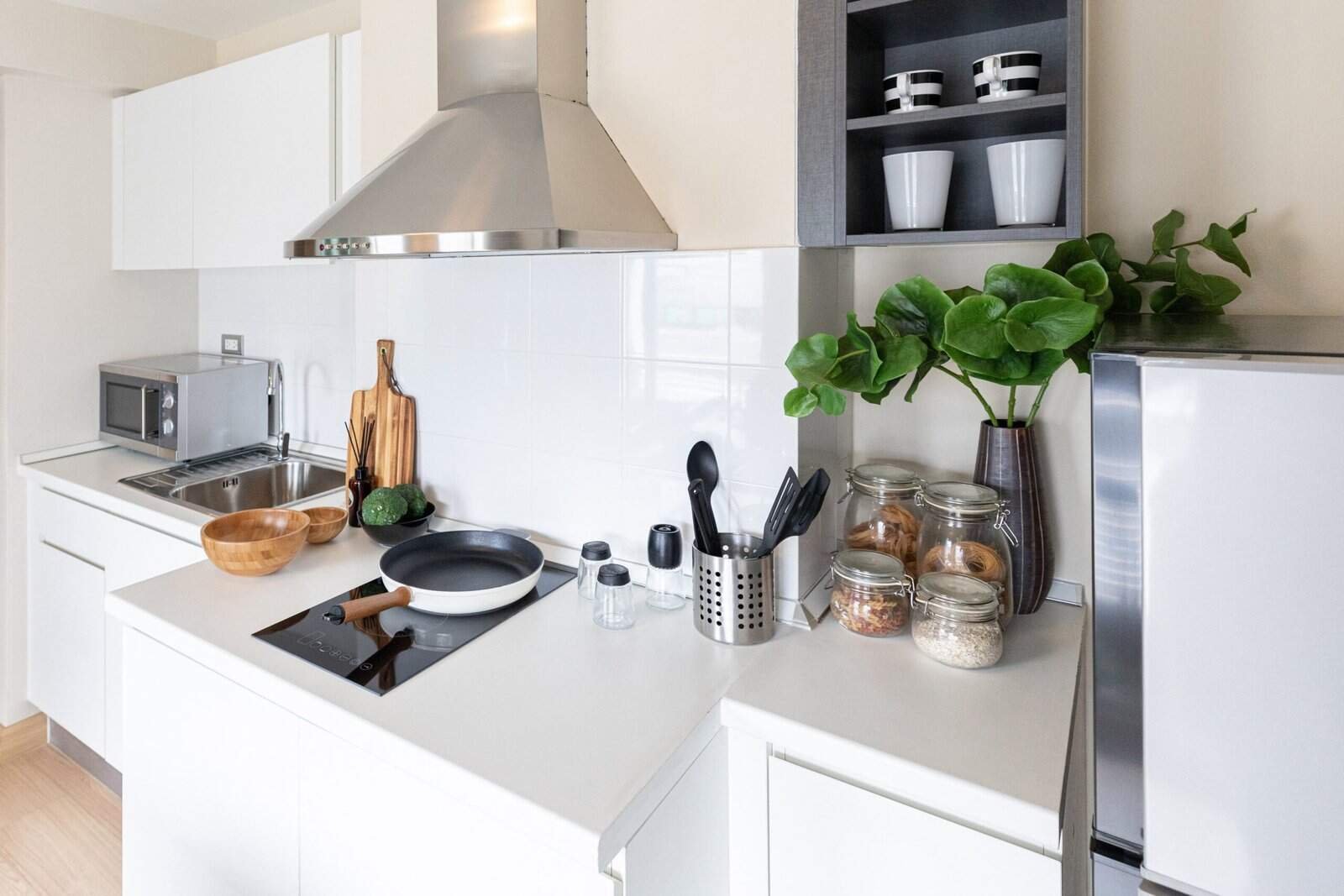 10 Kitchen Counter Decor Ideas 8 a kitchen with a stove top and a potted plant