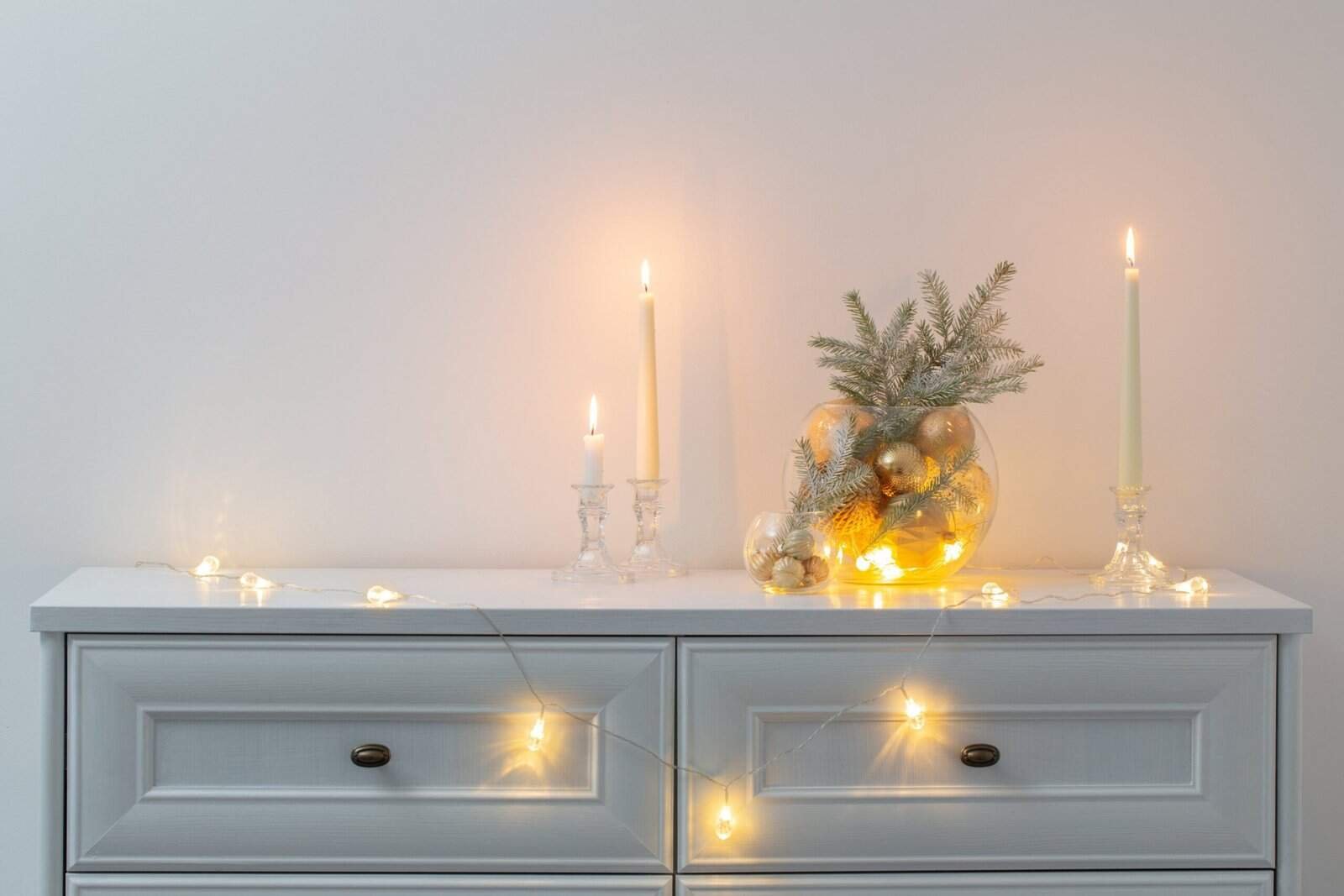 a dresser with candles and candles on it