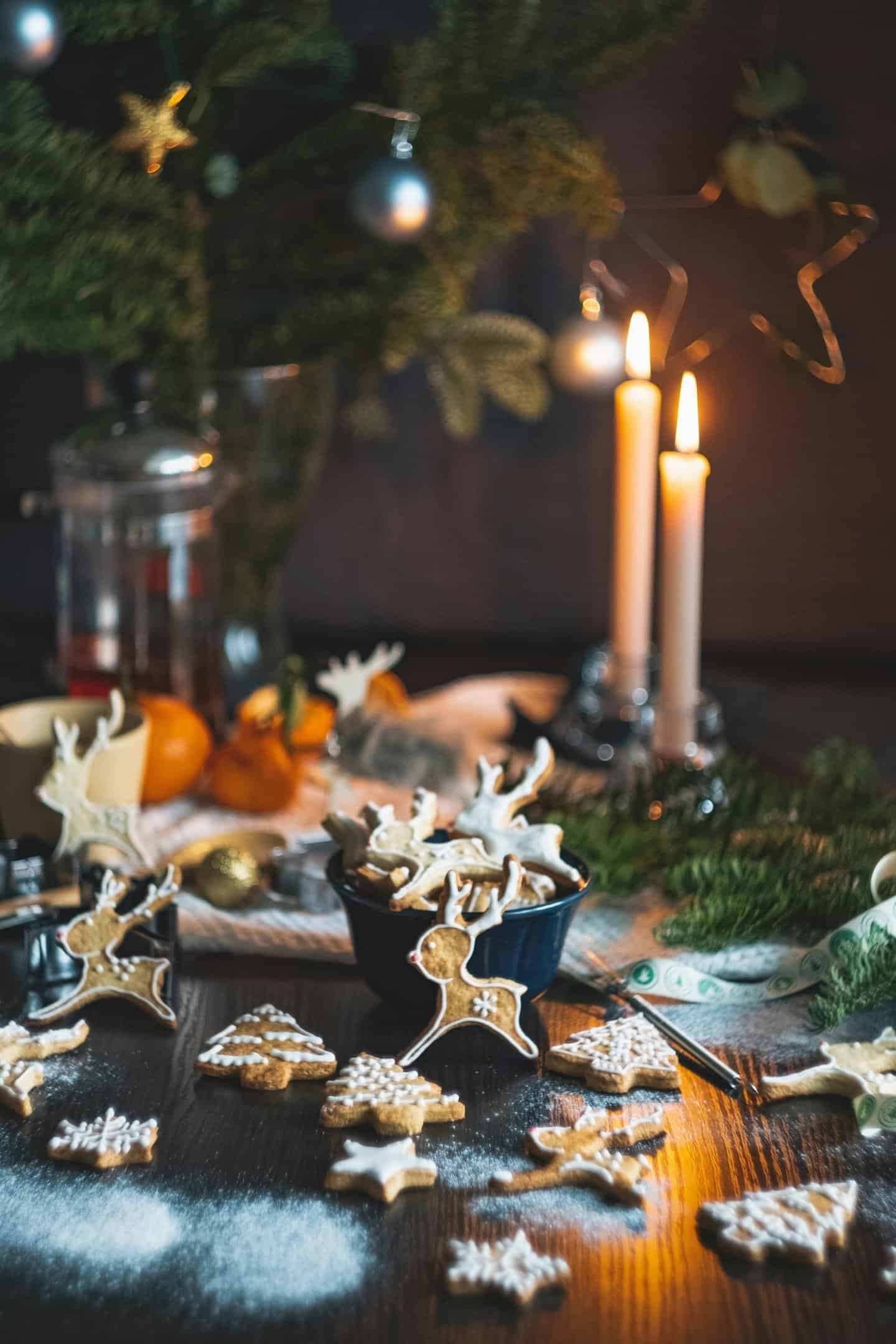 a table with cookies and candles on it