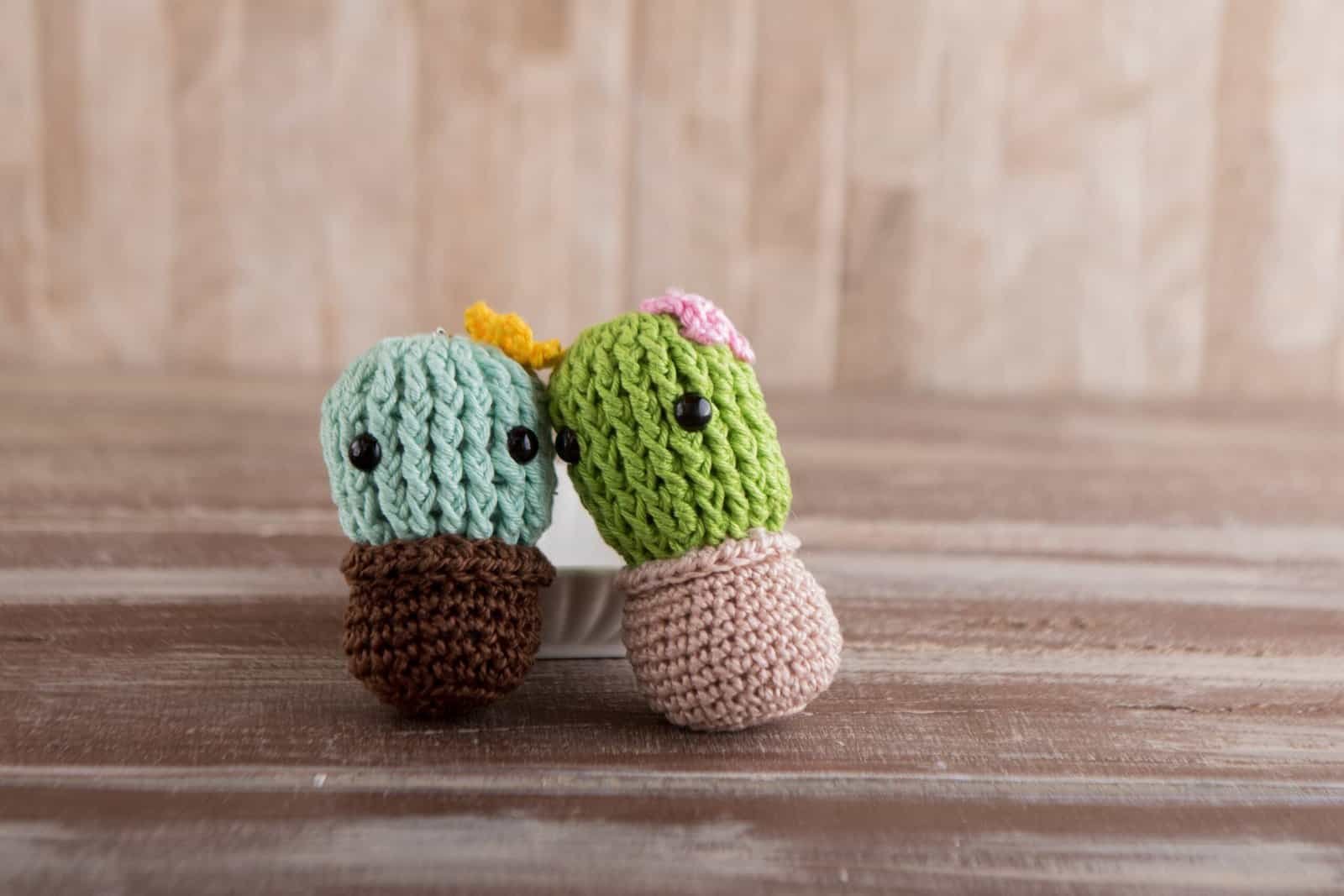 two crochet cactus plant in a cupcake
