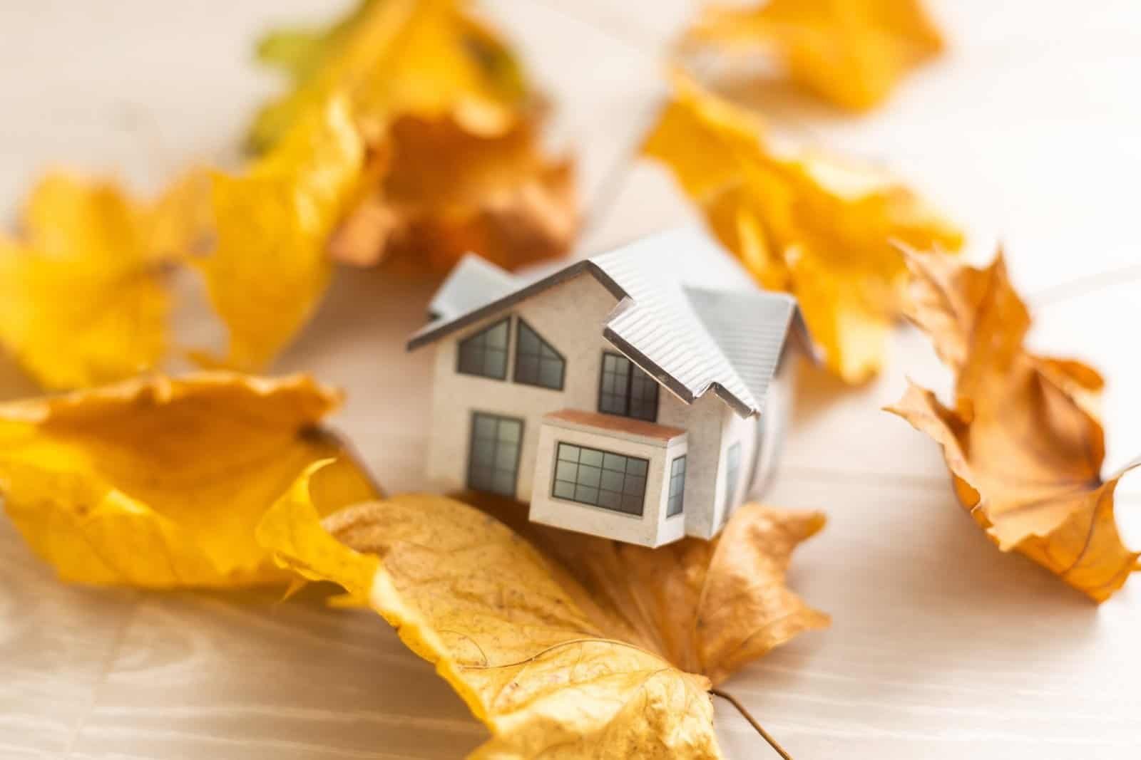 a small house sitting on a wooden table
